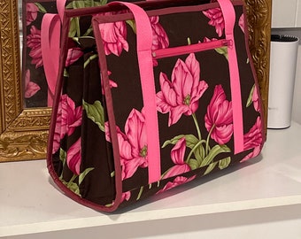 Ultimate carry all bag, great for traveling, crafting, quilting, beading, etc. 18 pockets, ironing pad inside, sleeve pocket for roller cart