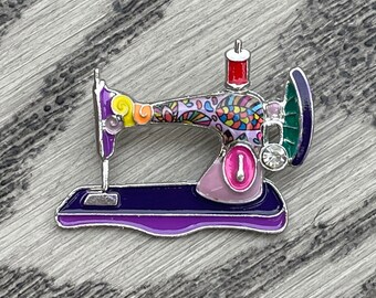 Sewing machine pin with enamel