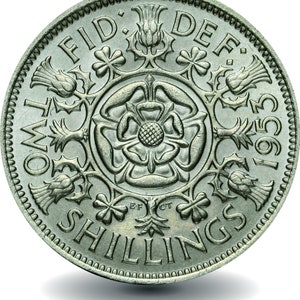 May include: A silver British two shilling coin with the inscription "TWO SHILLINGS" and "FID: DEF: 1953" around the edge. The centre of the coin features a rose, thistle, and shamrock design.