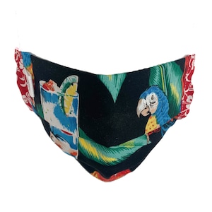 May include: A black face mask with a tropical print featuring a parrot, palm leaves, and a cocktail glass. The mask has red and white trim.