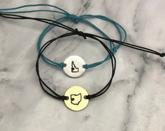 Any US State outline minimalist bracelet with heart over your city. cotton cord, adjustable knot choose your disc & cord colors ONE bracelet