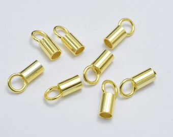 May include: Eight gold-toned metal end caps with a loop at the top. The end caps are cylindrical in shape and have a smooth finish.