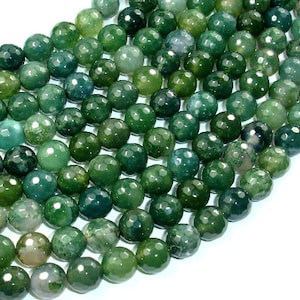 Peut inclure: Un brin de perles d'agate vertes avec une finition facetée. Les perles sont rondes et ont un aspect naturel et terreux.