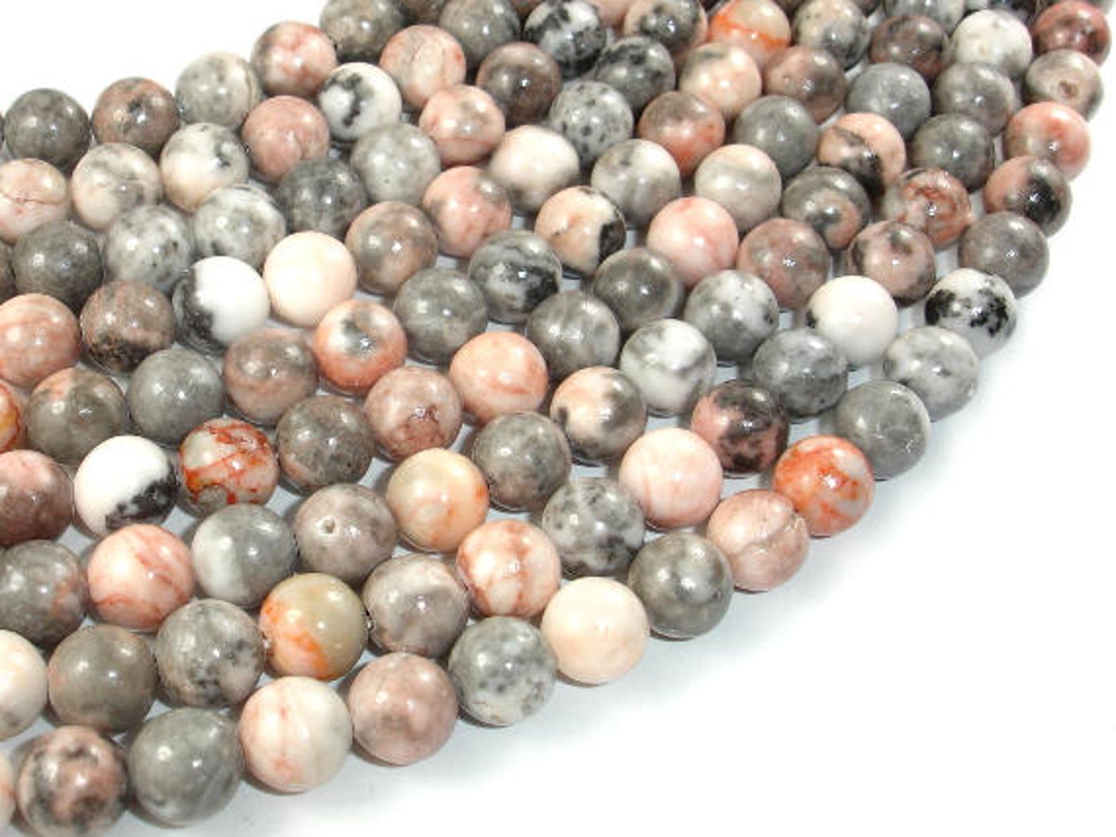 Розовая яшма бусины. Zebra jasper камень. Zebra jasper камень. Минерал камень зебры. Зебровая яшма камень.