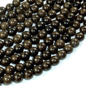 May include: A strand of dark brown and black round beads with a smooth, polished finish. The beads have a swirling pattern.