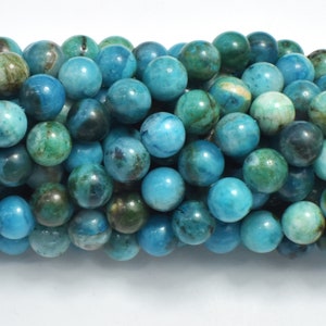 May include: A strand of round, blue and green gemstone beads. The beads have a mottled, marbled appearance.