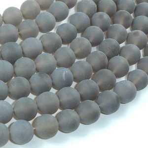 May include: A strand of grey agate beads. The beads are round and have a matte finish.