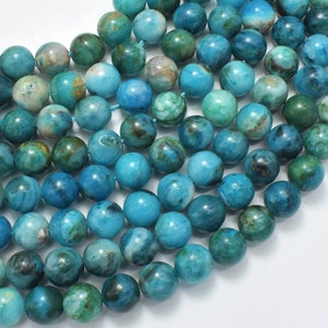 May include: A strand of blue and green agate beads. The beads are round and have a smooth, polished finish. They are perfect for making jewelry or other crafts.