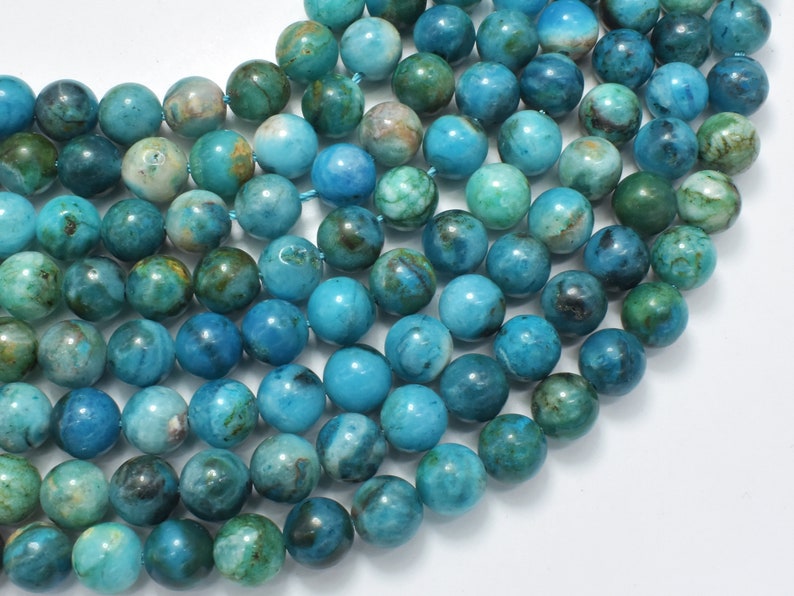 May include: A strand of blue and green agate beads. The beads are round and have a smooth, polished finish. They are perfect for making jewelry or other crafts.