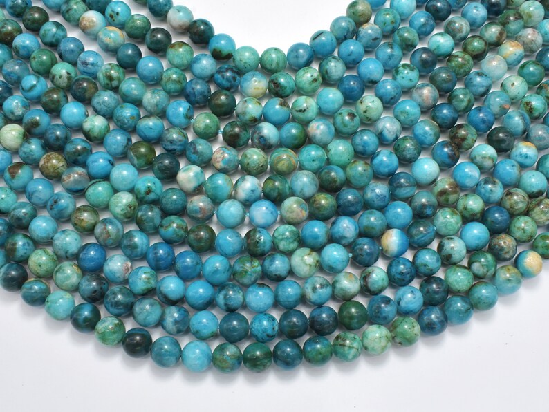 May include: A strand of turquoise blue gemstone beads with a mottled green and white pattern. The beads are round and smooth, and they are strung on a clear thread.
