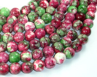 May include: A strand of round, green, pink, and white marble beads. The beads have a swirling pattern of color.