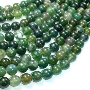 Peut inclure: Un brin de perles d'agate vertes, chaque perle est ronde et lisse. Les perles sont un mélange de nuances de vert clair et foncé avec quelques marbrures blanches.