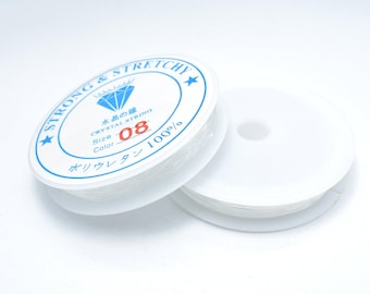 May include: Two spools of clear, stretchy crystal string. One spool is partially unraveled. The label reads "STRONG & STRETCHY", "CRYSTAL STRING", "Size 08", and "100%" in English and Japanese.