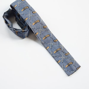 Heavenrich’s 1950s Faded Blue Skinny Tie with Revolvers
