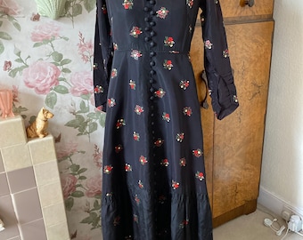 Antique Edwardian black taffeta dress with hand stencilled red and green flowers. Waist 28”