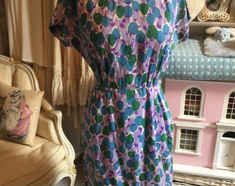 1950s purple and green wiggle dress