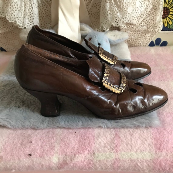 Antique Edwardian brown leather shoes with a brass
