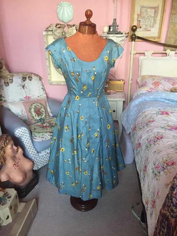 1950s blue and yellow floral fit and flare dress.