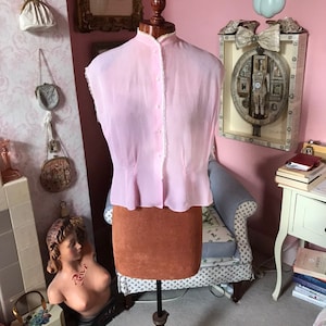 1940s pink and white candy stripe blouse with lace trim.