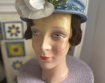 1940s vintage pale blue straw tilt hat with net and white flower.