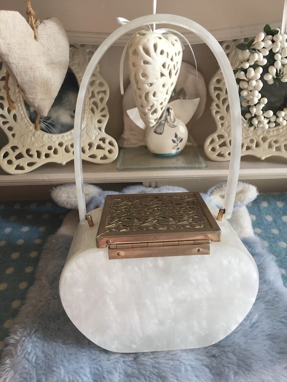 1950s 'tyrolean' lucite bag with decorative lid.
