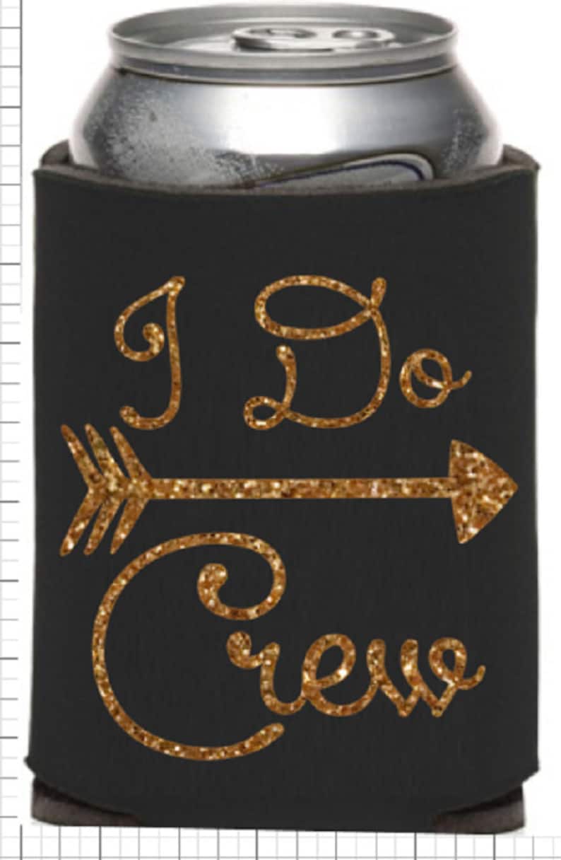 May include: Black foam can cooler with gold glitter lettering that reads "I Do Crew" with an arrow pointing to the right.