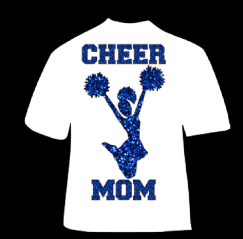 May include: White t-shirt with the words "CHEER MOM" in blue glitter lettering. A blue glitter cheerleader silhouette is jumping with pom-poms. The shirt is a short-sleeved crew neck.