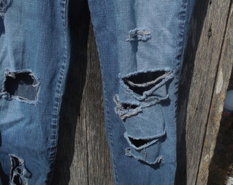 light blue jeans with holes