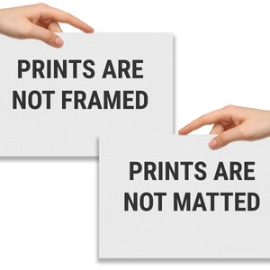 Two hands holding signs that say prints are not framed and prints are not matted.