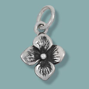 May include: A silver-colored charm in the shape of a four-petal flower with a small, round center. The charm has a loop at the top for attaching to a necklace or bracelet. The flower's petals have detailed veining.