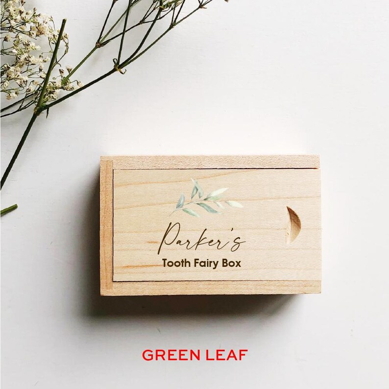 May include: A wooden box with a green leaf design and the text "Parker's Tooth Fairy Box" engraved on the lid.