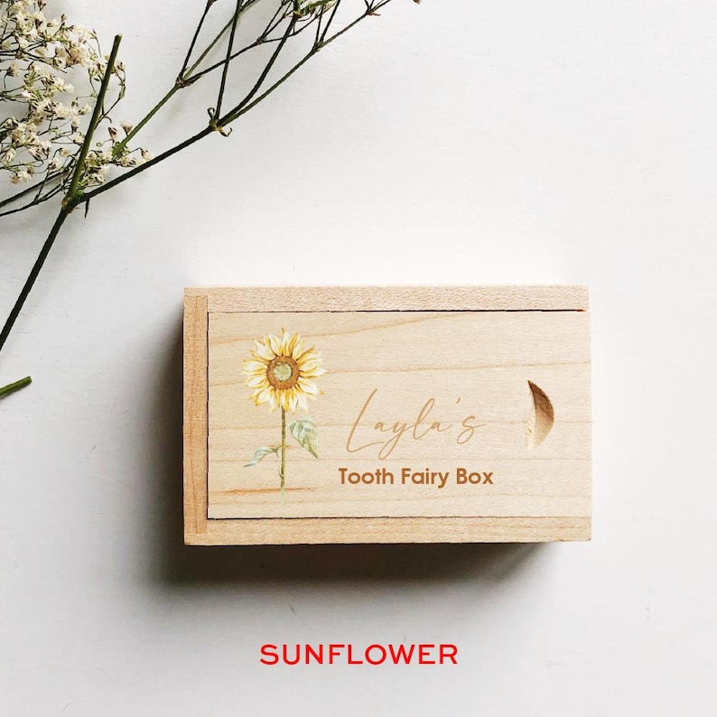 May include: A wooden tooth fairy box with a sunflower design and the text "Layla's Tooth Fairy Box".