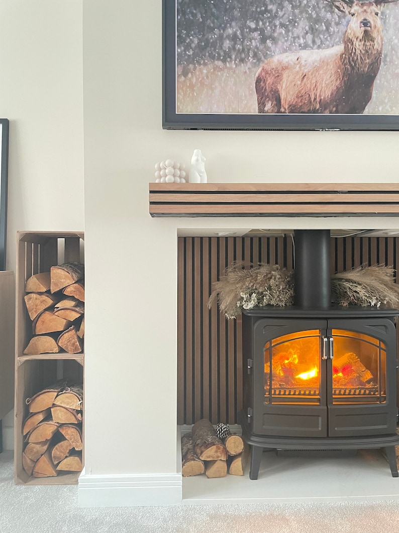 Log storage. Tall, narrow, wooden log storage crate with internal shelf. For storing logs and kindling