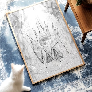 Könnte beinhalten: Gerahmte Schwarz-Weiß-Skizze einer Krone mit Mond. Das Kunstwerk liegt auf einem blau-weiß gemusterten Teppich. Eine weiße Katze betrachtet das Kunstwerk. Ein hölzerner Beistelltisch mit einer Pflanze befindet sich im Hintergrund.