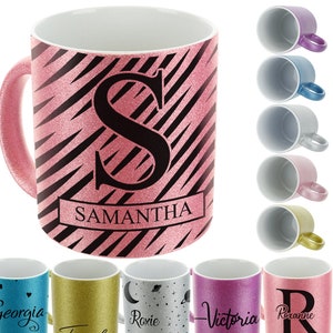 May include: Set of 10 personalized glitter mugs with various colors and designs. Each mug features a different name and initial. The mugs are perfect for adding a touch of personalization to your home.