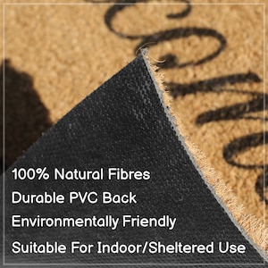 May include: Close-up of a coir doormat with a black rubber backing. The mat has the words "Welcome" printed on it. The text on the mat reads: "100% Natural Fibres, Durable PVC Back, Environmentally Friendly, Suitable For Indoor/Sheltered Use."