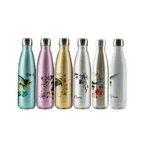 May include: Six stainless steel water bottles with different colored glitter finishes and floral and bee designs. The bottles are labeled "Nora" and "Grace".