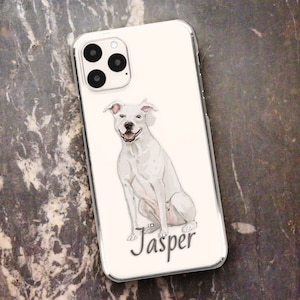 May include: White phone case with a watercolor illustration of a white dog sitting. The dog's name, "Jasper", is written in cursive below the dog.