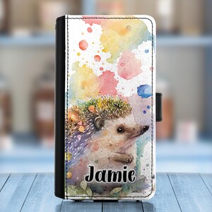 May include: A watercolor phone case with a colorful background and a hedgehog with the name Jamie printed on it.