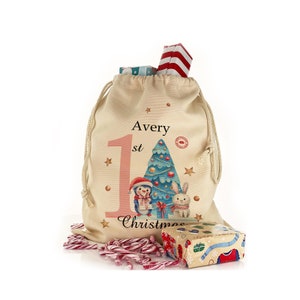 Personalised 1st Christmas gift sack with snowman design on a drawstring bag, great stocking with name added