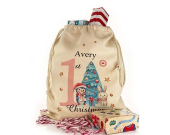 Personalised 1st Christmas gift sack with snowman design on a drawstring bag, great stocking with name added