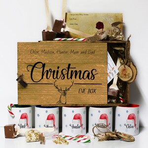 Caja de Nochebuena personalizada con tapa, incluye taza y agitador de chocolate caliente, bastón de caramelo, carta de Papá Noel, bolas de comida de reno con nombre