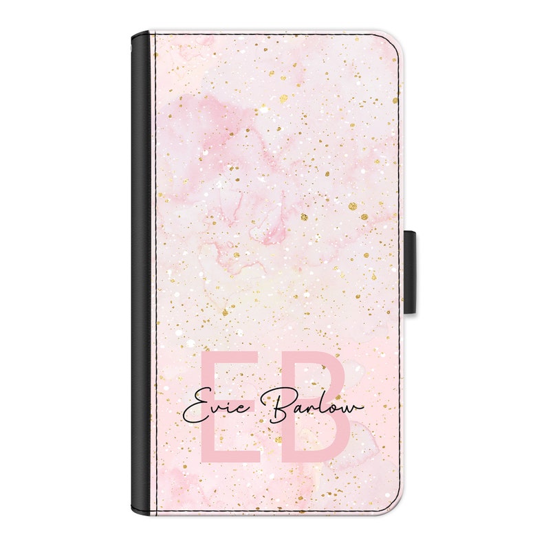 May include: A pink and gold marble phone case with the initials "EB" and the name "Evie Barlow" written in cursive.