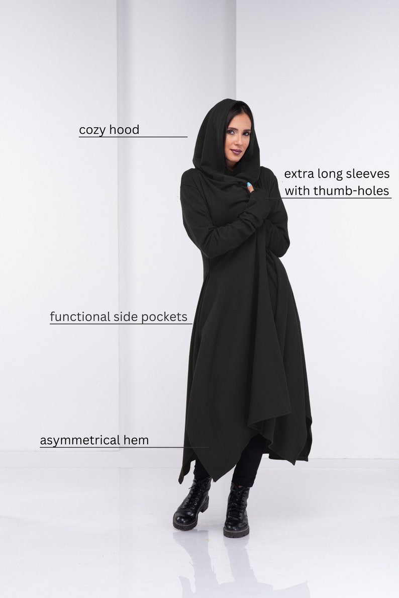 May include: Black hooded long-sleeve dress with an asymmetrical hem, functional side pockets, and extra long sleeves with thumb holes.