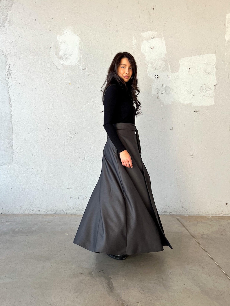 Long wool wrap skirt made from super soft fabric, featuring side pockets and an elegant, flowing design.
