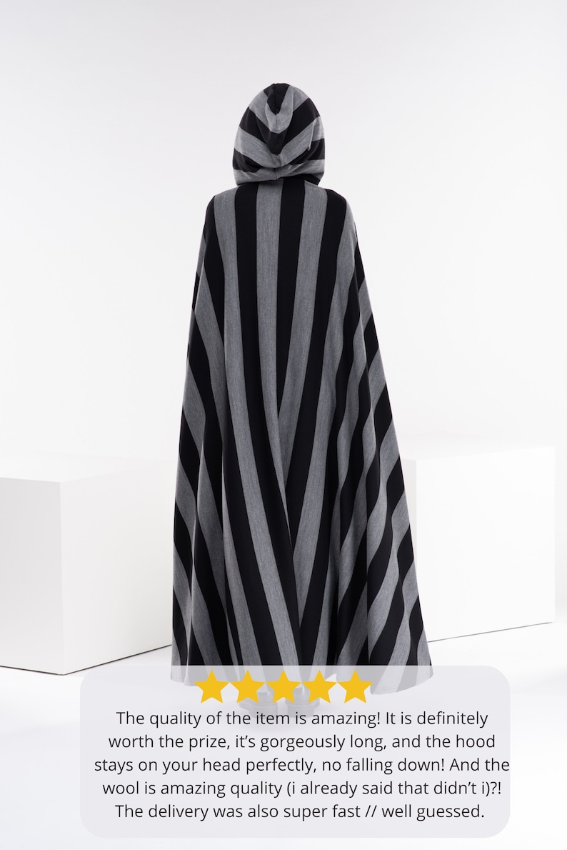 May include: A black and gray striped hooded cape. The caption reads: "The quality of the item is amazing! It is definitely worth the prize, it's gorgeously long, and the hood stays on your head perfectly, no falling down! And the wool is amazing quality (i already said that didn't i)?! The delivery was also super fast // well guessed."