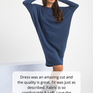 May include: A woman wearing a dark blue long-sleeved dress with a relaxed fit. The dress is made of a soft, comfortable fabric. The text "Dress was an amazing cut and the quality is great. Fit was just as described. Fabric is so comfortable & soft. Love the style." is displayed below the image. Five gold stars are displayed below the text.