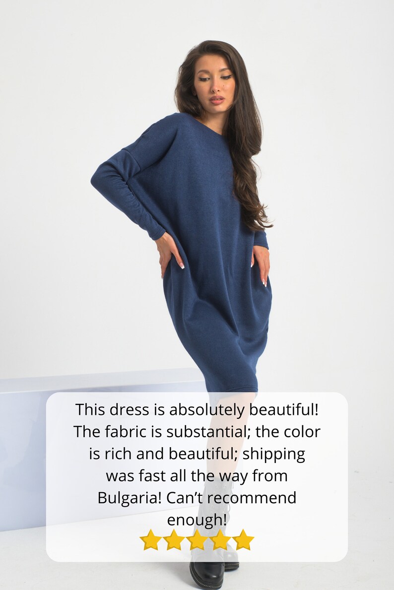 May include: A navy blue long-sleeved dress with a relaxed fit. The dress is made of a soft, substantial fabric. The model is wearing the dress with black ankle boots. The text in the image reads: "This dress is absolutely beautiful! The fabric is substantial; the color is rich and beautiful; shipping was fast all the way from Bulgaria! Can't recommend enough!"