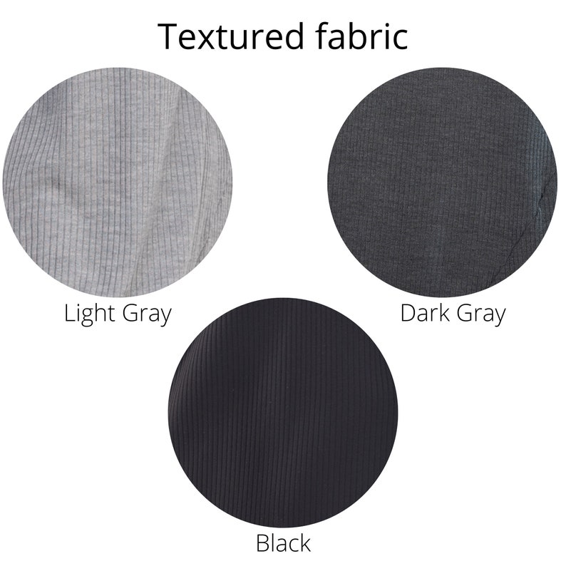 May include: Close-up of textured fabric in three colours: light grey, dark grey, and black.