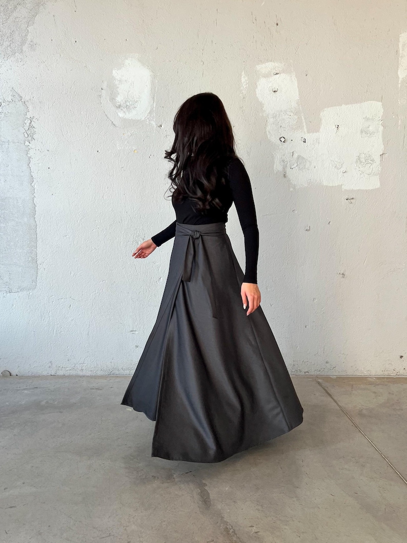 Long wool wrap skirt made from super soft fabric, featuring side pockets and an elegant, flowing design.